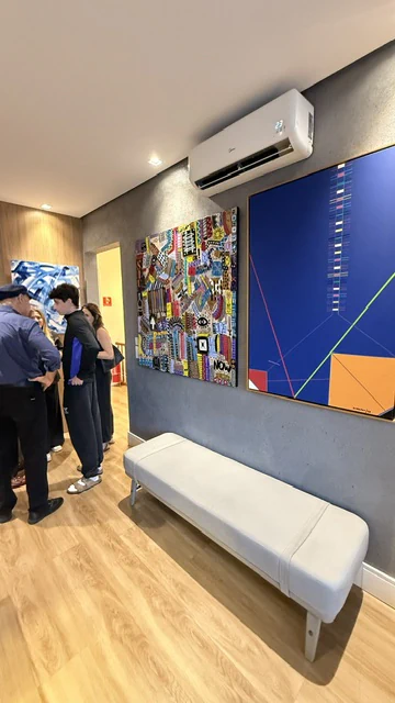 Installation view of Alessandro's painting in a gallery corridor.