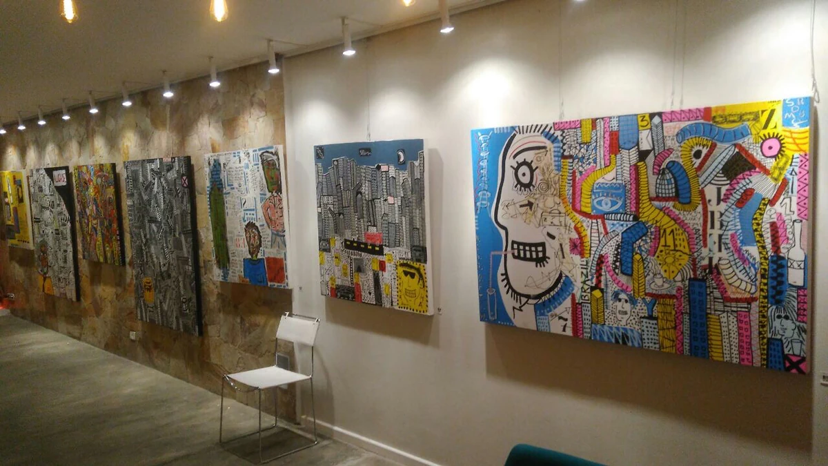 Panoramic installation view with several paintings by Alessandro.